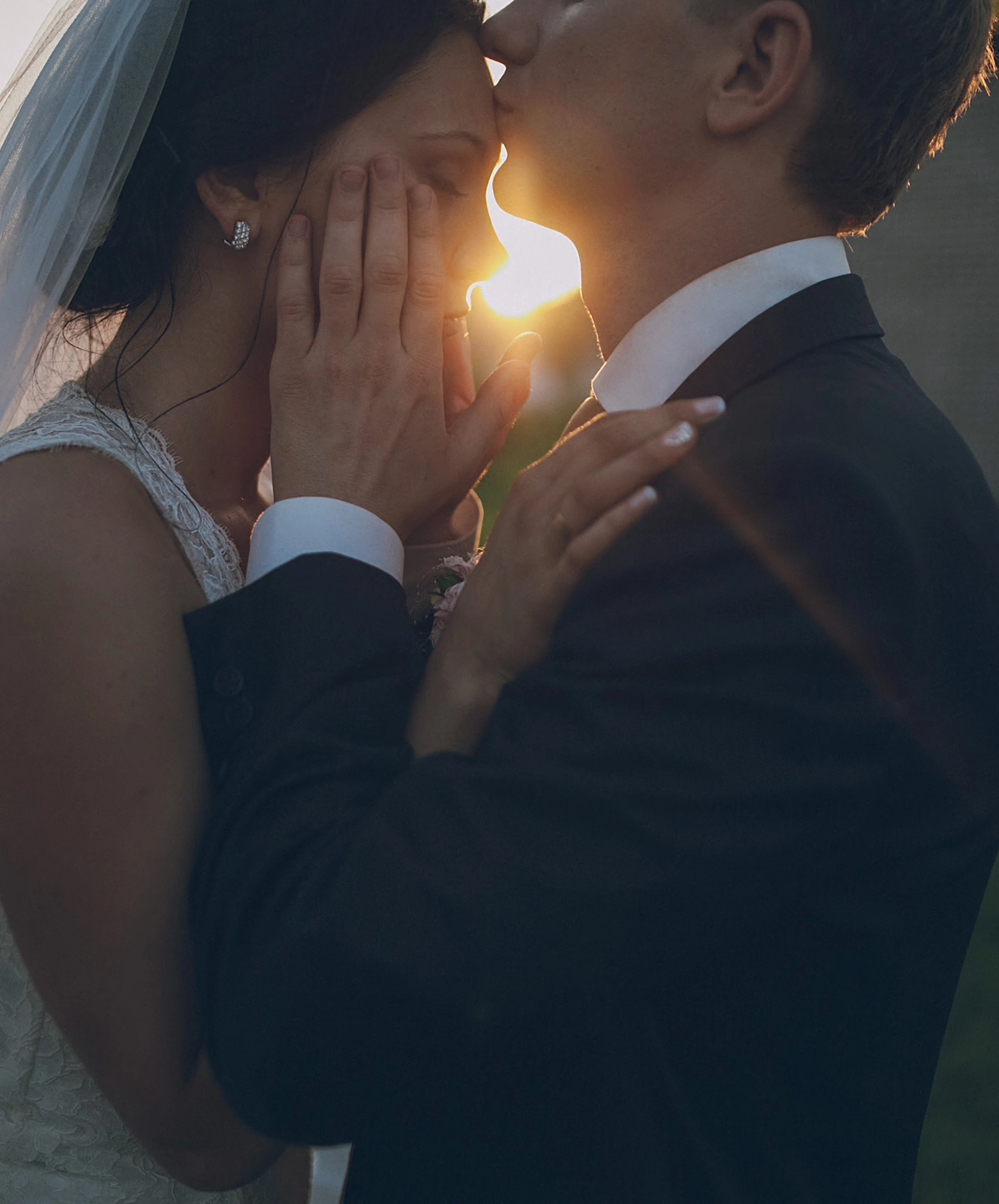 Wedding rings held in the bride and groom's hands